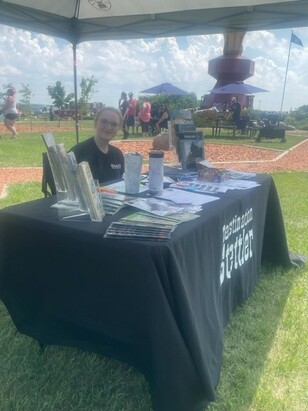 Summer Staff running our mobile tourism kiosk in summer 2023.